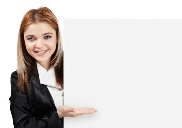 Happy business woman showing something on white board — Stock Photo, Image