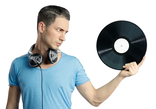 Young male holding black vinyl in hand — Stock Photo, Image