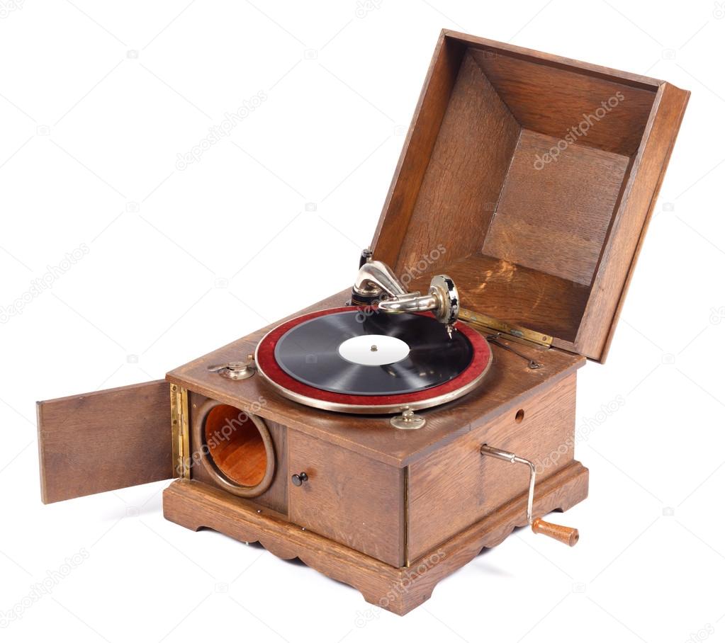 Angle view of old wooden gramophone against white background