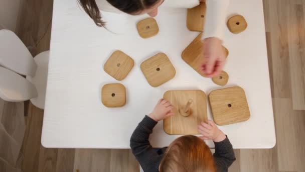 Top View Young Mother Baby Daughter Play Wooden Blocks Sit — Stock Video