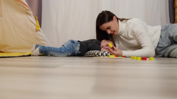 Affectionate Loving Young Woman Lifting Cuddling Little Baby Daughter Playing — Stock Video