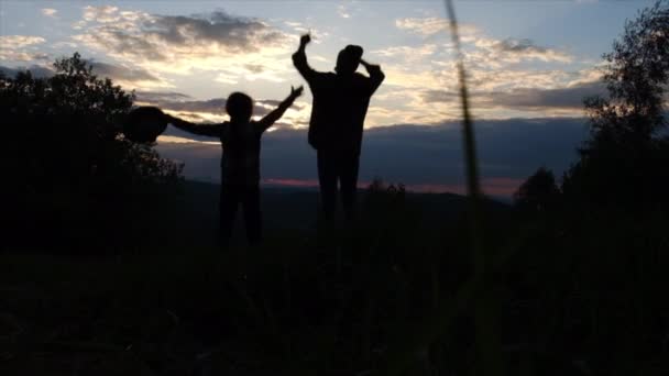 Silhouette Happy Playful Young Mother Little Daughter Jumping Mountains Background — Stock Video