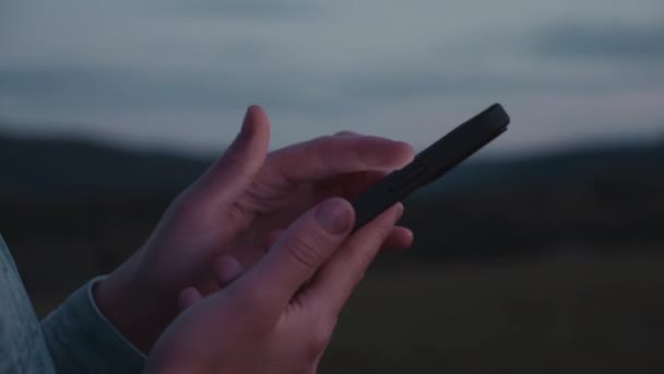 Close Female Hands Use Smartphone Background Night Mountains Cinematic Shot — Stockvideo