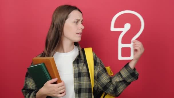 Puzzled Pensive Girl Teen Student Holding Question Marks Books Wears — Vídeo de Stock