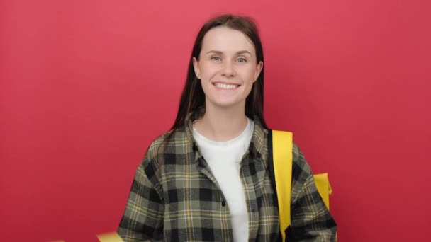 Cheerful Beautiful Young Student Woman Wears Backpack Demonstrate Two Books — Stock video