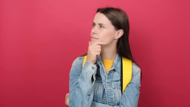 Portrait Thoughtful Young Student Woman Yellow Backpack Having Doubts Questioning — Stockvideo