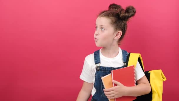 Portrait Cute Little School Girl Holding Notebooks Yellow Arrow Pointing — Video Stock