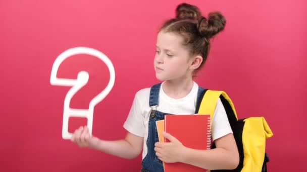 Pensive Little Kid Girl Holding Big Question Marks Notebooks Wears — Stok Video