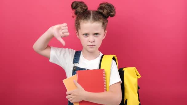 Dislike Concept Dissatisfied Little Kid Girl Holding Two Notebooks Gesturing — Vídeos de Stock