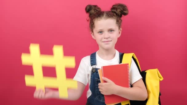 Adorable Schoolgirl Backpack Holding Big Yellow Hashtag Symbol Notebooks Happy — ストック動画