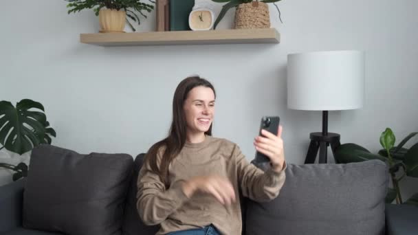 Smiling Young Caucasian Woman Enjoying Pleasant Conversation Using Mobile Web — 图库视频影像