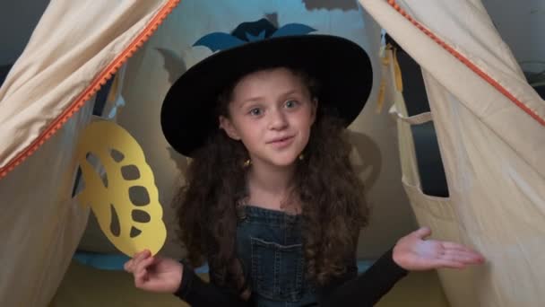 Playful Fun Little Girl Child Black Hat Hold Hands Yellow — Vídeo de stock