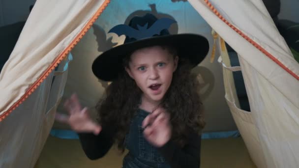 Close Fun Little Girl Child Wearing Black Hat Says Boo — Stockvideo