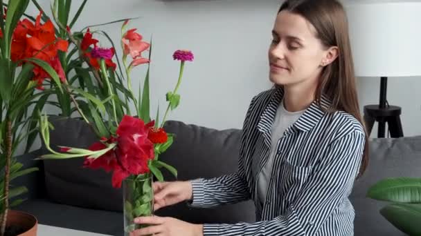 Young Woman Enjoys Smell Fresh Flowers Living Room Happy Adult — Video