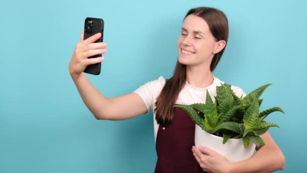 Happy Cute Young Girl Florist Blogger Being Photographed Plants Pot — Stock video