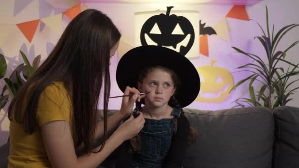 Close Cute Young Mother Painting Face Little Daughter Child Halloween — Stock Video