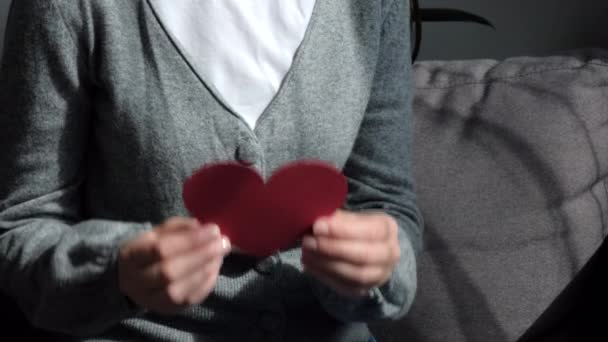 Close Young Woman Holding Small Red Paper Heart Sitting Cozy — Stock Video