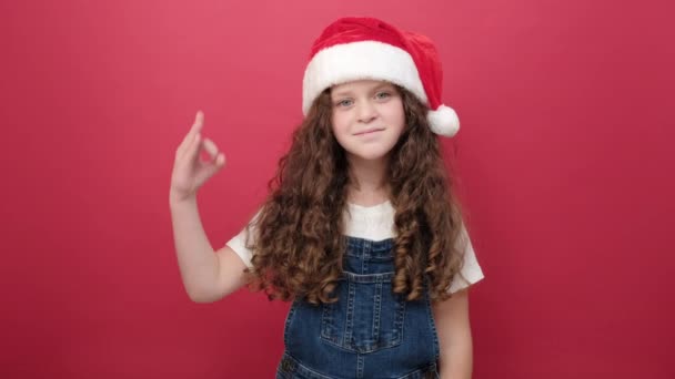 Portrait Cute Little Girl Santa Hat Showing Sign Smiling Looking — Stock Video