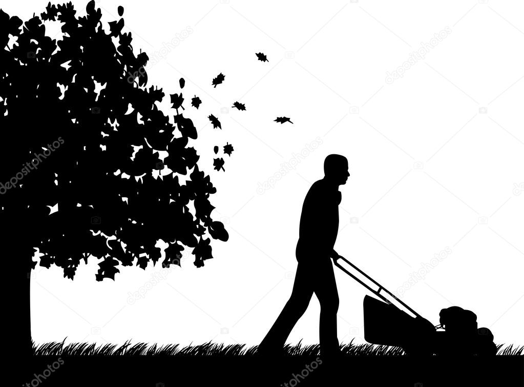 Man cut the lawn or mow the grass in garden in autumn or fall silhouette