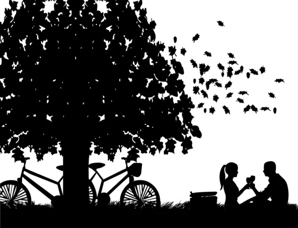 Couple romantique en pique-nique, avec vélos dans le parc sous le pain grillé à l'arbre avec verre de vin en automne ou en automne silhouette — Image vectorielle