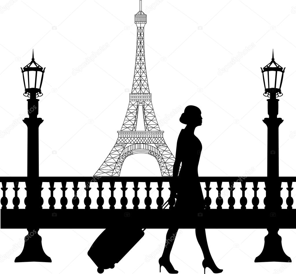 A business woman traveling on business trip in Paris and passes in front of Eiffel tower silhouette
