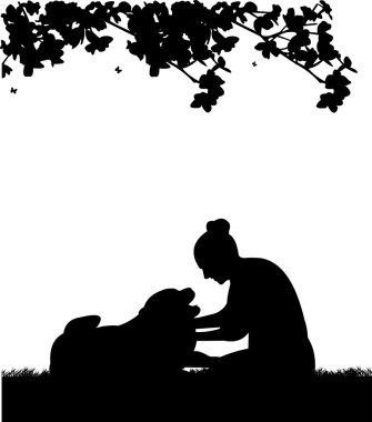 Happy girl playing and petting his dog in garden silhouette