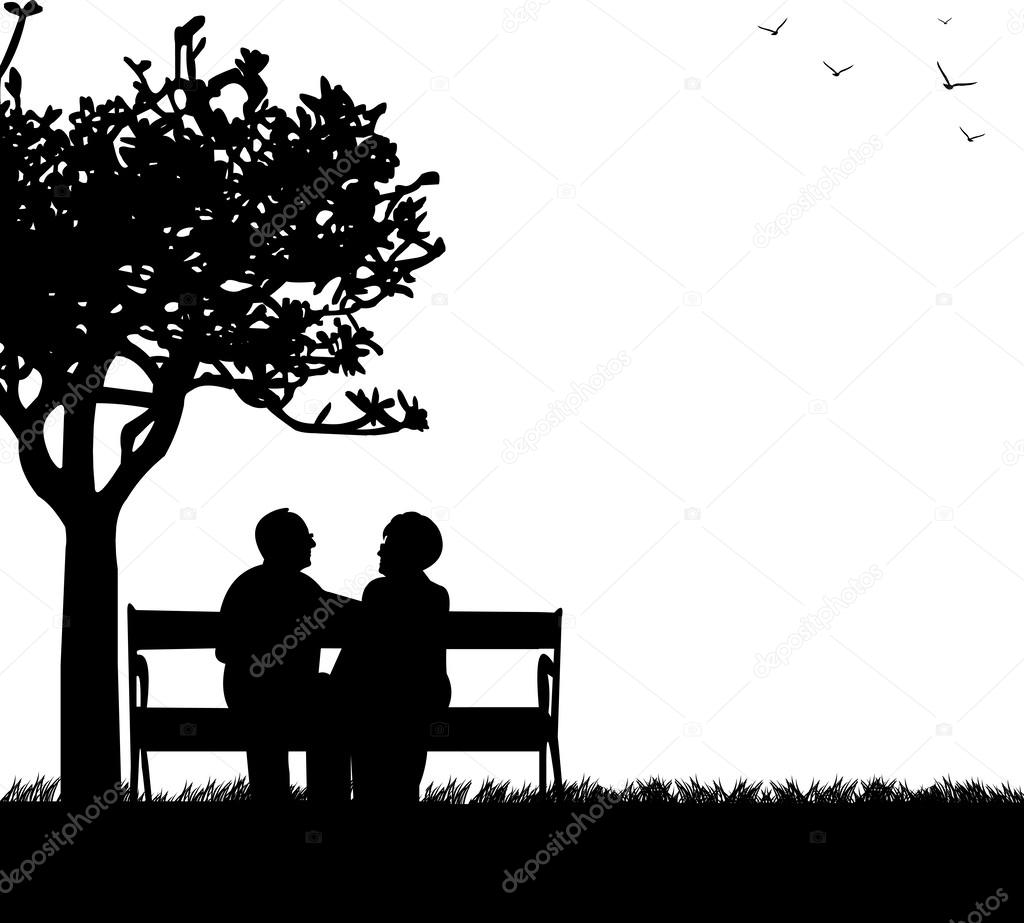 Lovely retired elderly couple sitting on bench in park or garden