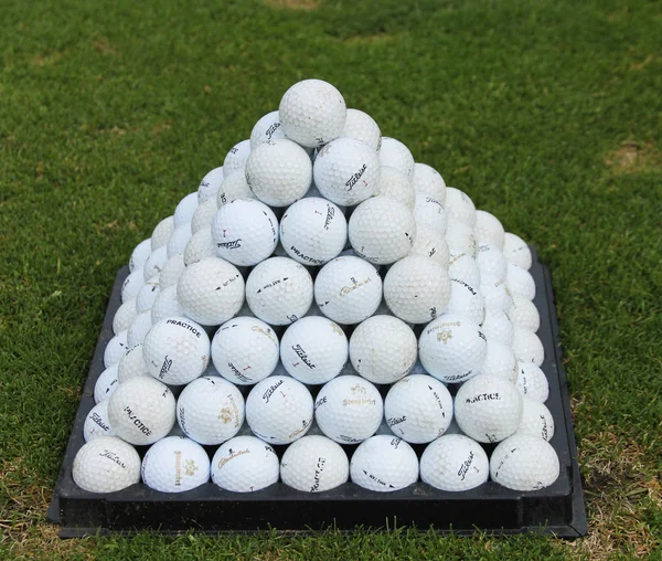 Golf balls pyramid on driving range — Stock Photo, Image