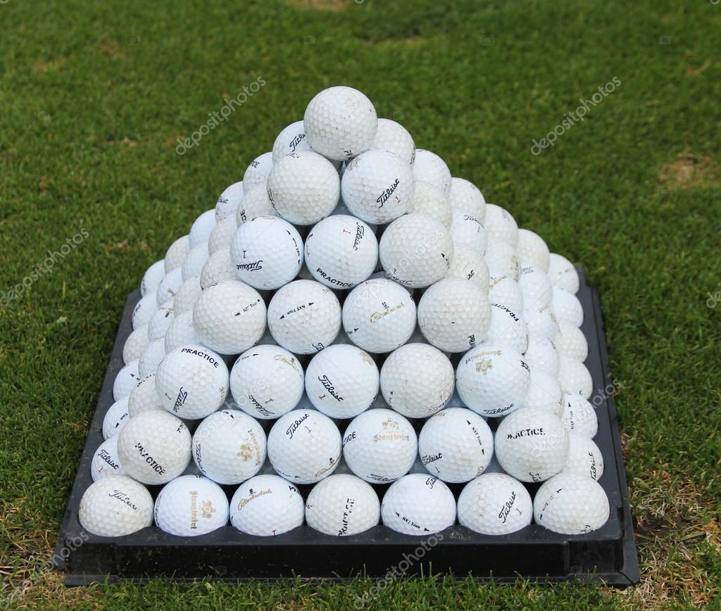 Golf balls pyramid on driving range Stock Photo by ©zhukovsky 21229313