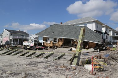 Destroyed beach house and truck four months after Hurricane Sandy on February, 28, 2013 in Far Rockaway, NY clipart