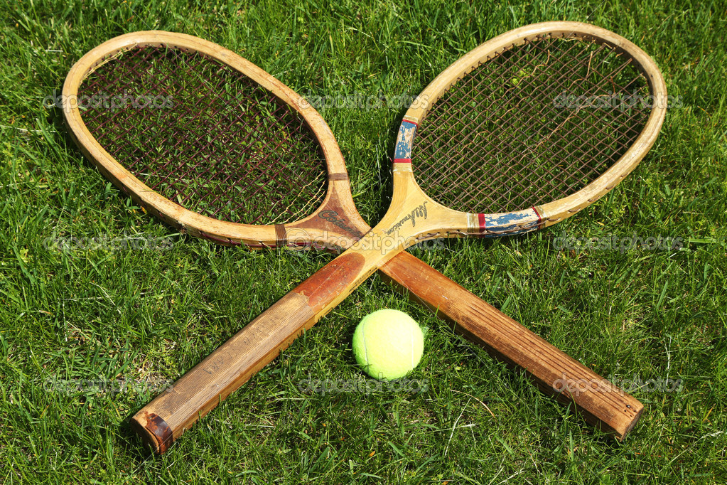 Old tennis rackets on grass court Stock Editorial Photo