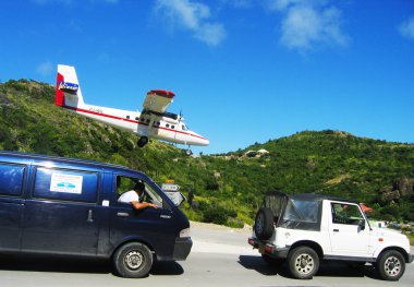 Risky plane landing at St Barts airport clipart