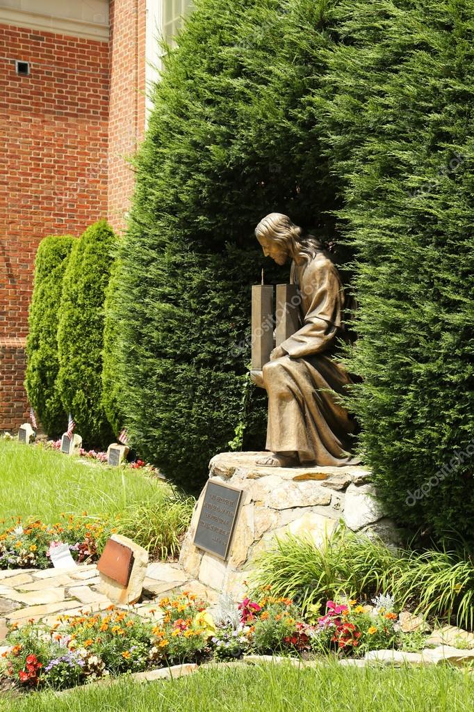 September 11 Memorial Bronze statue of Jesus Christ holding World
