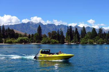 High speed jet boat on the Lake Wakatipu in the South Island of New Zealand clipart
