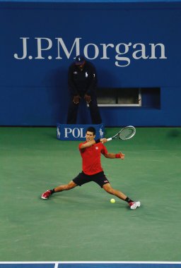 US Open 2013 finalist Novak Djokovic during his final match against champion Rafael Nadal clipart