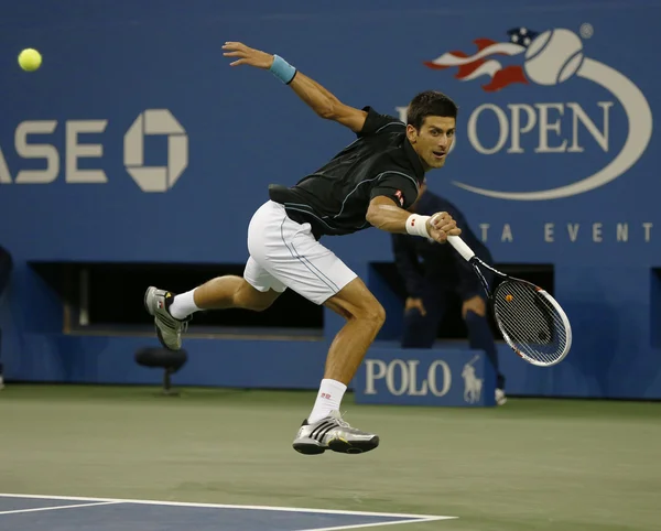 Professional tennis player Novak Djokovic during quarterfinal match at US Open 2013 against Mikhail Youzhny — Stock Photo, Image