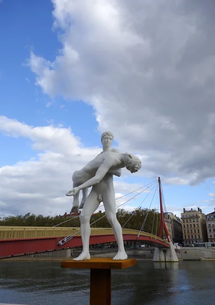 The weight of One Self sculpture by Michael Elmgreen and Ingar Dragset in the front of Bridge of the Palace of Justice in Lyon — Stock Photo, Image