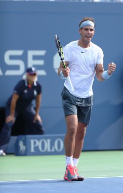 Twelve times Grand Slam champion Rafael Nadal celebrates victory after third round singles match at US Open 2013 clipart
