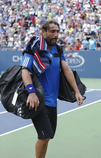 Professional tennis player Marcos Baghdatis from Cyprus leaving Louis Armstrong stadium after third round match loss at US Open 2013 — Stock Photo, Image