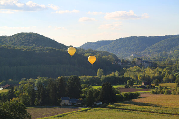 Hot air balloons flying over Dordogne in southwestern France