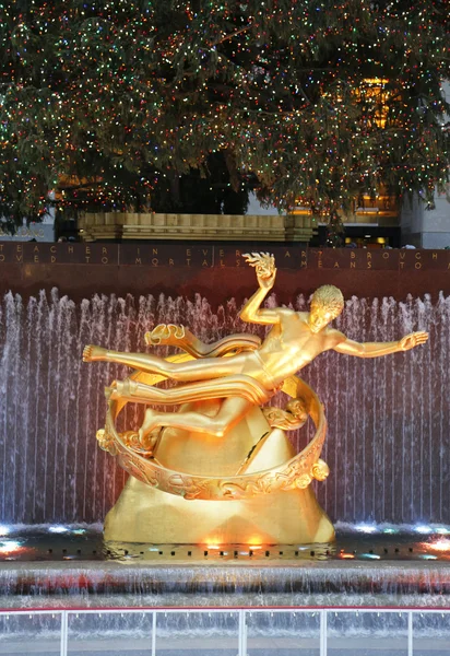 Statue of Prometheus under Rockefeller Center Christmas Tree at the Lower Plaza of Rockefeller Center in Midtown Manhattan