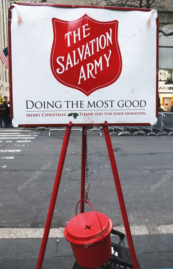 NEW YORK - DECEMBER 19: Salvation Army red kettle for collections on December 19, 2013 in midtown Manhattan. This Christian organization is known for its charity work, operating in 126 countries