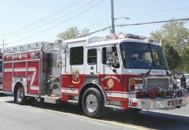 Huntington Manor Fire Department fire truck at the parade in Huntington , New York clipart