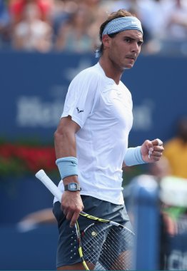 Twelve times Grand Slam champion Rafael Nadal during third round singles match against Ivan Dodig at US Open 2013 at Billie Jean King National Tennis Center clipart