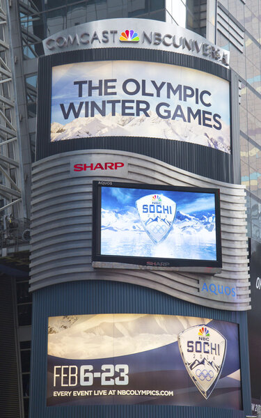 Comcast NBC Universal billboard decorated with Sochi 2014 XXII Olympic Winter Games logo near Times Square in Midtown Manhattan