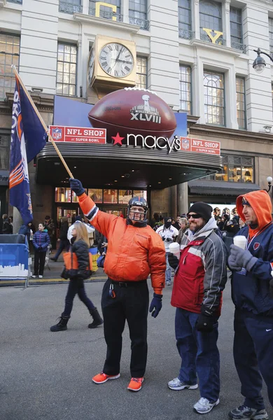 Unidentified Denver Broncos fans in the front of Macy s Herald Square on  Broadway during Super Bowl XLVIII week in Manhattan – Stock Editorial Photo  © zhukovsky #39950597
