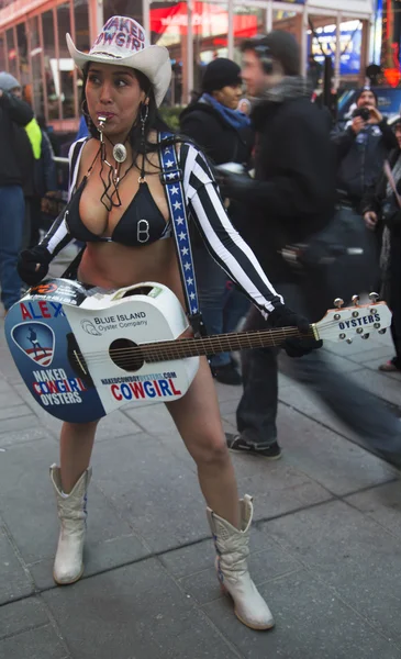 Alex, the Naked Cowgirl, entertains the crowd in Times Square during Super Bowl XLVIII week in Manhattan