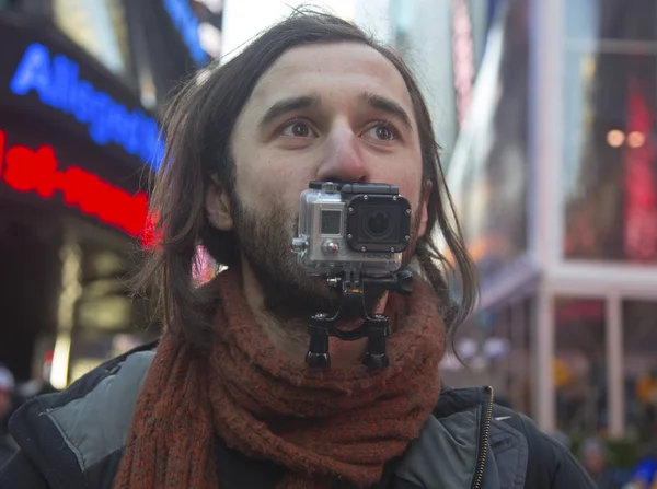 Unidentified man shooting video using Hero3 camera on Broadway — Stock Photo, Image