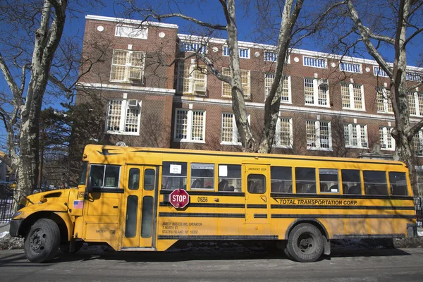 School bus in the front of public school in Brooklyn