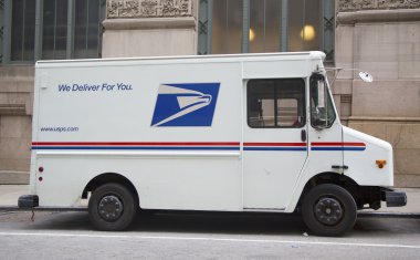 United States Postal Service truck in midtown Manhattan clipart